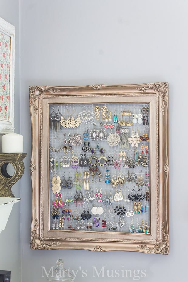 Frame with chicken wire used as an earring organizer