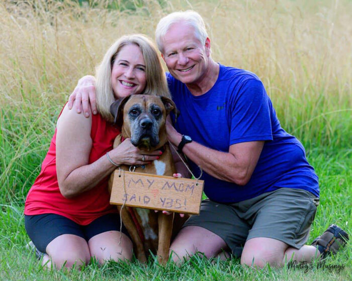 My Mom said yes sign on dog with happy couple