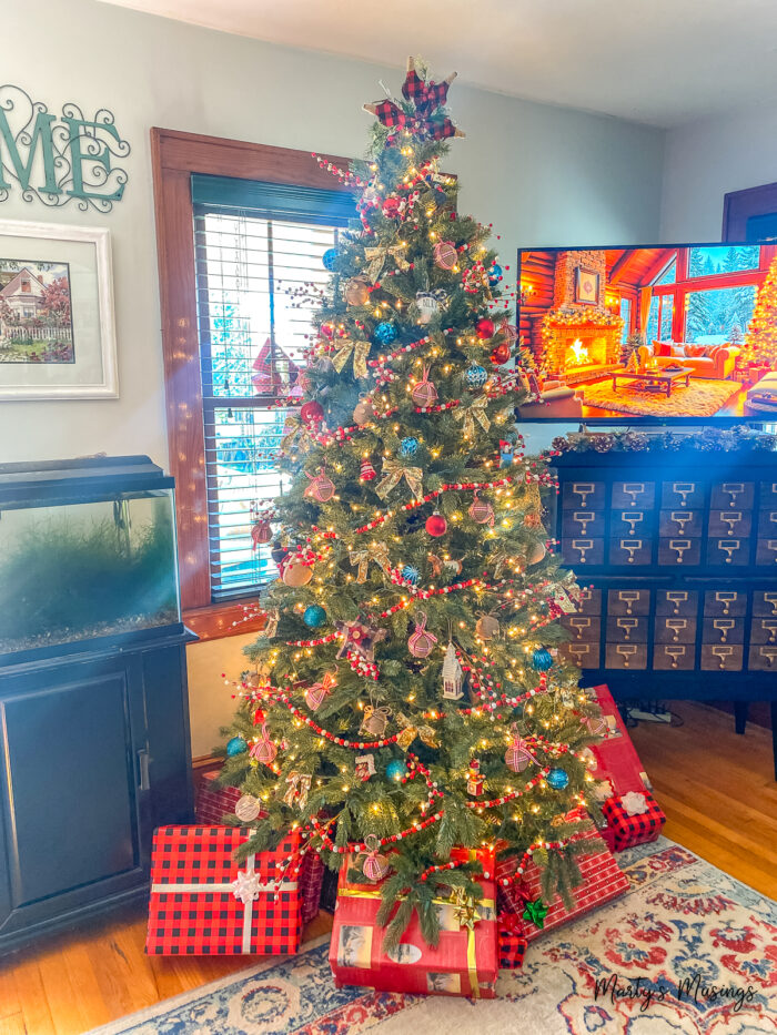 Christmas tree with red buffalo check decorations and blue ornaments