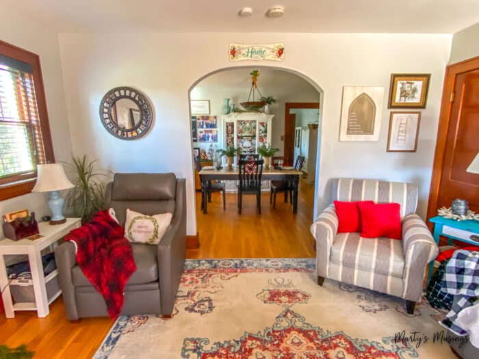 Craftsman style home with arch in living room decorated for Christmas