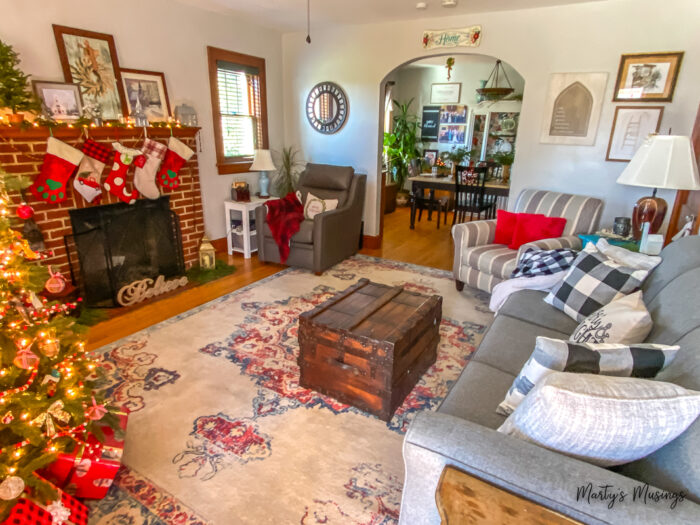 Craftsman home living room decorated for Christmas with traditional reds and greens