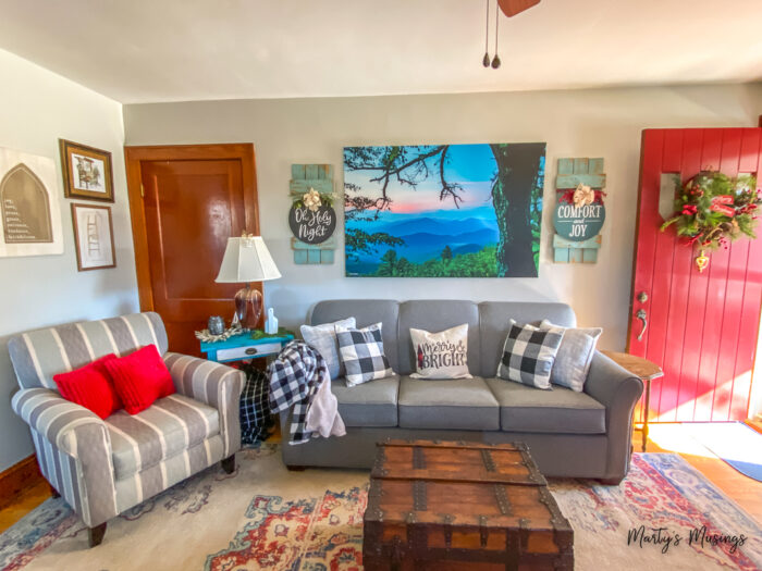 Craftsman home living room decorated for Christmas with black and white buffalo plaid and reds