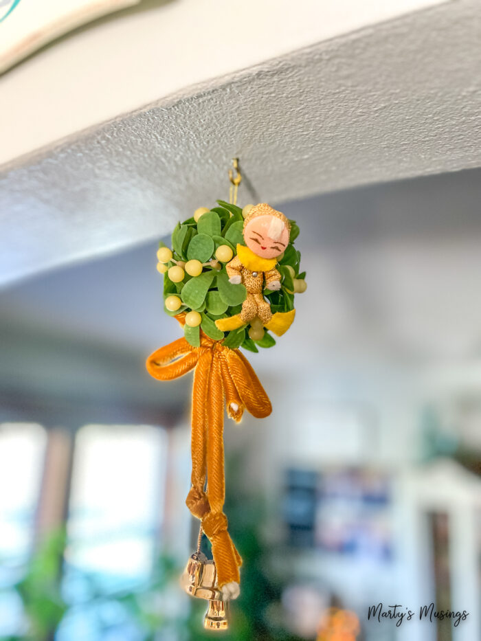 Vintage mistletoe hanging from archway